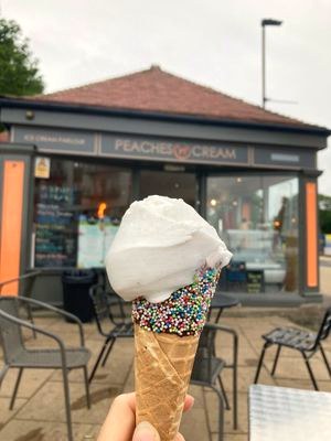 Ice cream cone with sprinkles outside the parlour